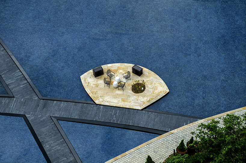 The Camellias Club water garden illuminated at night